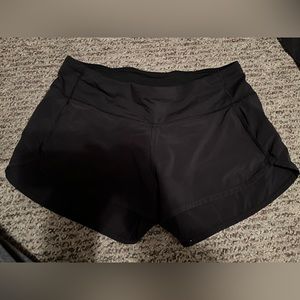 black lululemon speed ups. size 4. i believe 2.5 inch low rise as well.